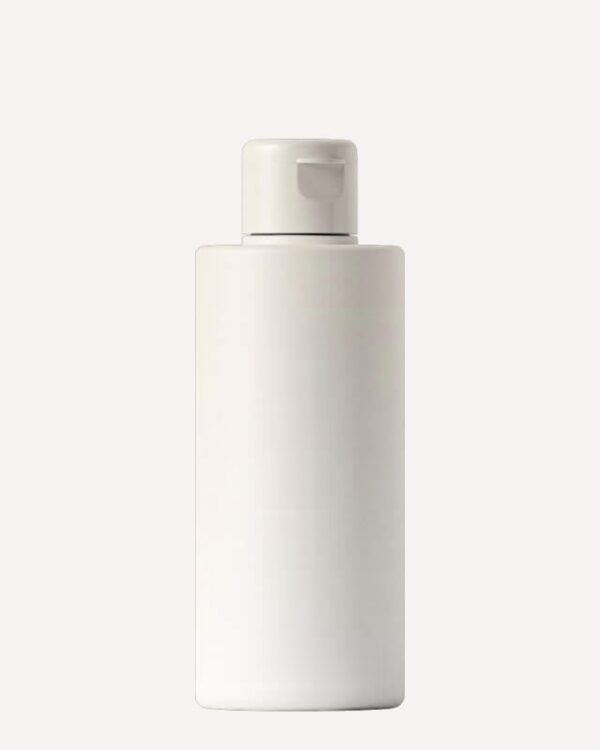 Milk Cleanser in a white bottle with a flip-top cap